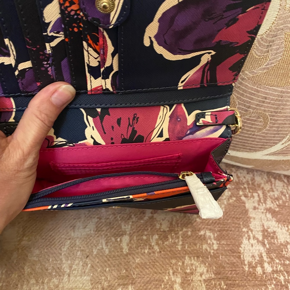 Adorable Trina Turk clutch style purse with strap and side pocket